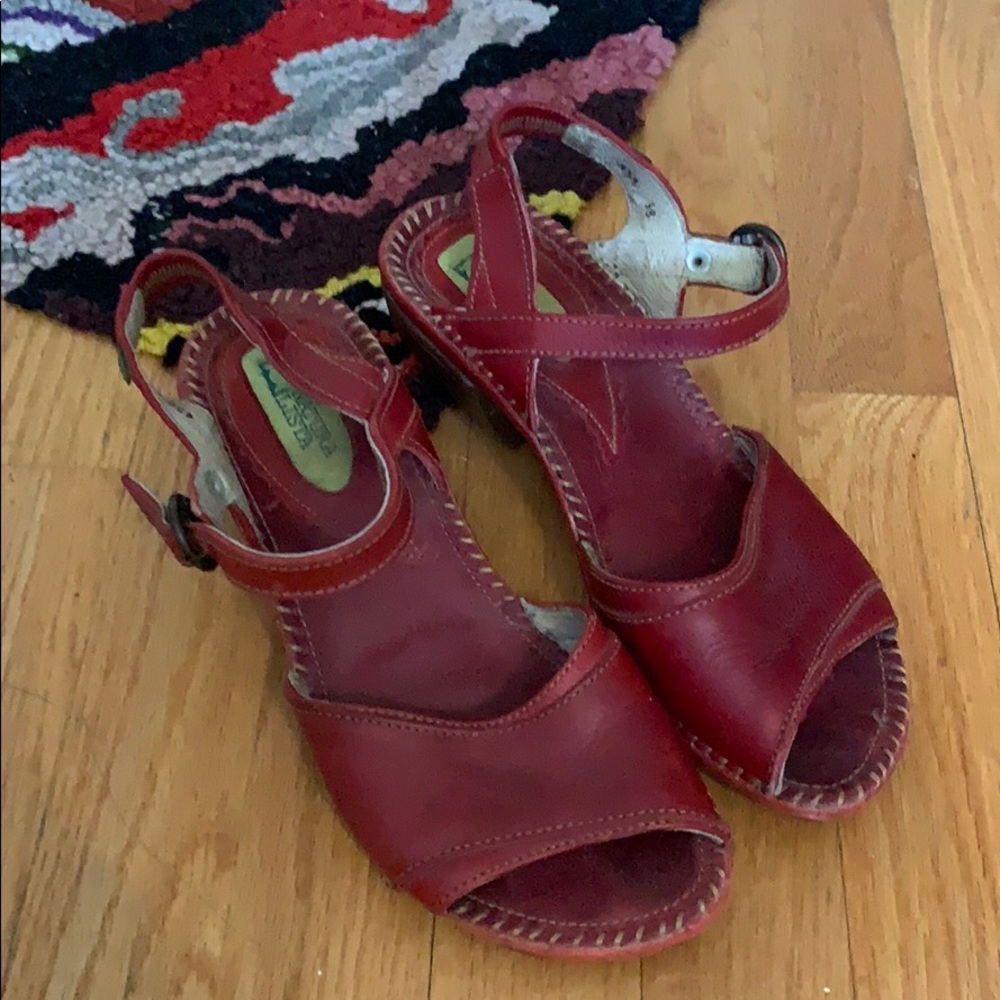 38 deep red El Naturalista sandal.